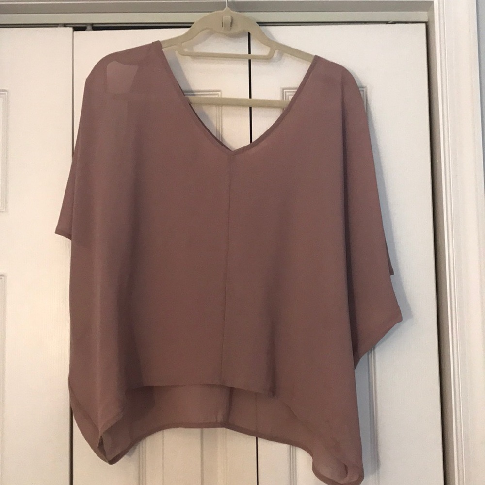 Blush colored shirt with open shoulders